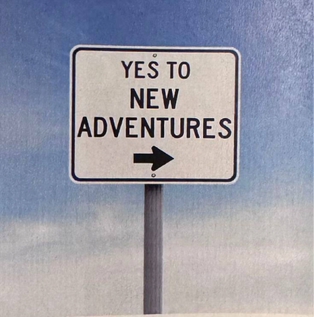 Roadside sign reading YES TO NEW ADVENTURES